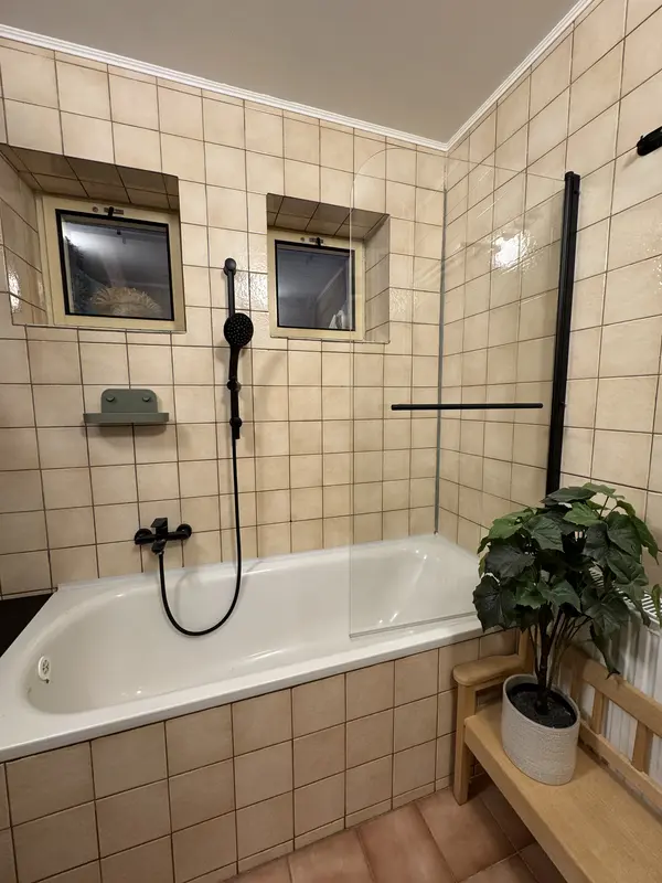 Bathroom with a shower and bathtub