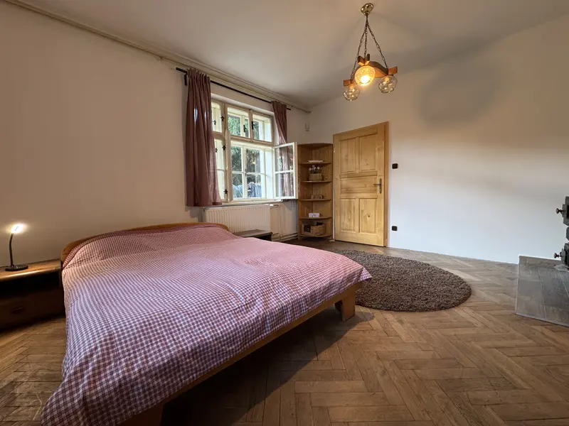 Spacious bedroom with a chandelier