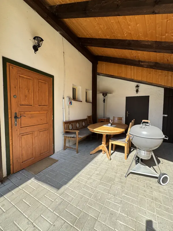 Covered terrace with a grill